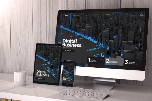 Digital generated devices on desktop, responsive digital business website on screen. All screen graphics are made up. 3d rendering.