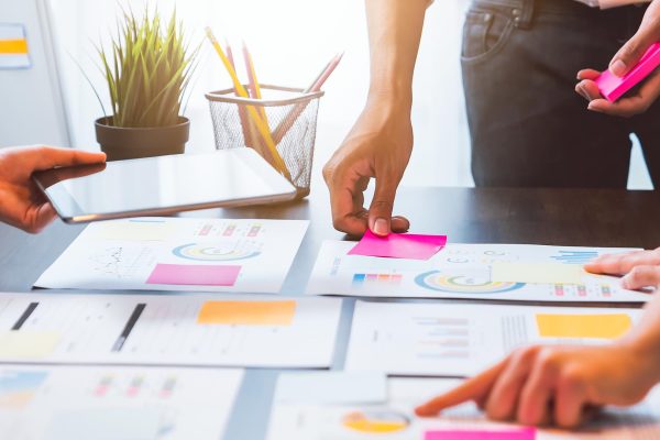 Teamwork Brainstorming Meeting and new startup project in workplace, Quality successful work concept, vintage effect.